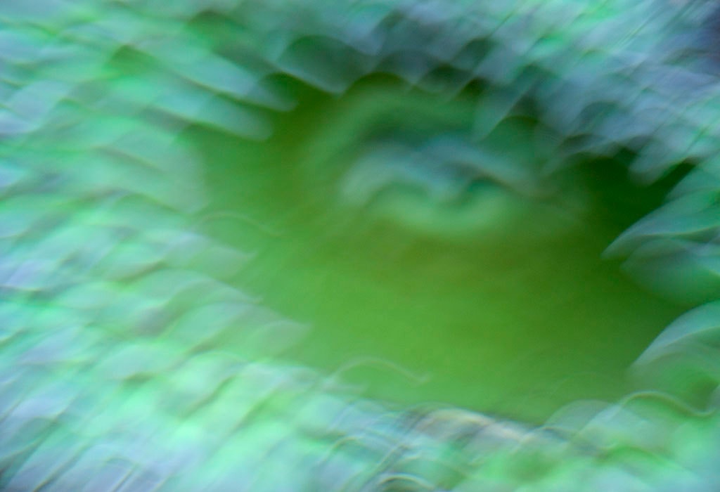 Depoe Bay, OR 2017 — green and blue-grey abstract with motion blur and dark center void