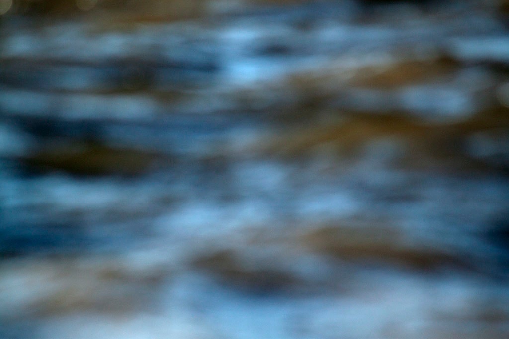 Depoe Bay, OR 2017 — blurred coastal water abstract, cool blue-grey and warm tan horizontal wave bands