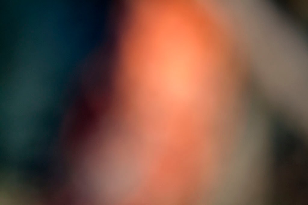 Depoe Bay, OR 2017 — dramatic sunset abstract, vertical warm peach column flanked by deep teal left and cool grey right