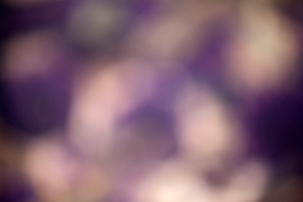 Depoe Bay, OR 2017 — deep purple bokeh abstract, large soft white orbs scattered across dark violet ground