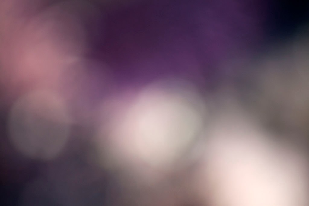 Depoe Bay, OR 2017 — deep purple bokeh abstract, three large white orbs along lower edge on dark violet ground