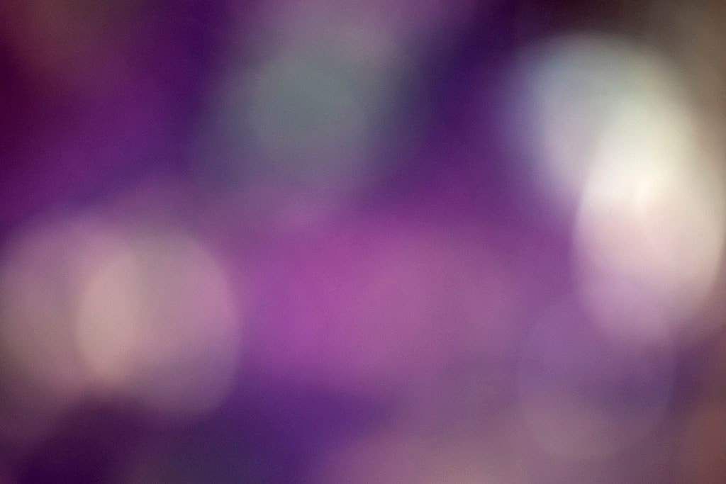 Depoe Bay, OR 2017 — vivid purple bokeh abstract, two large white orbs flanking saturated violet center band