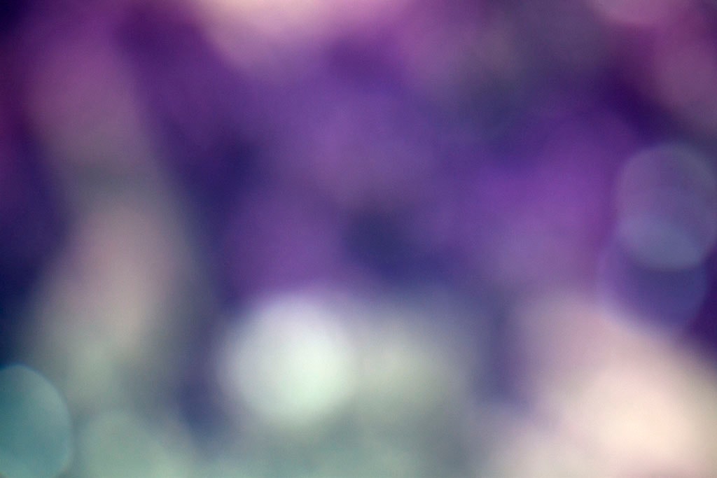 Depoe Bay, OR 2017 — cool purple and teal bokeh abstract, scattered orbs on deep violet and slate ground