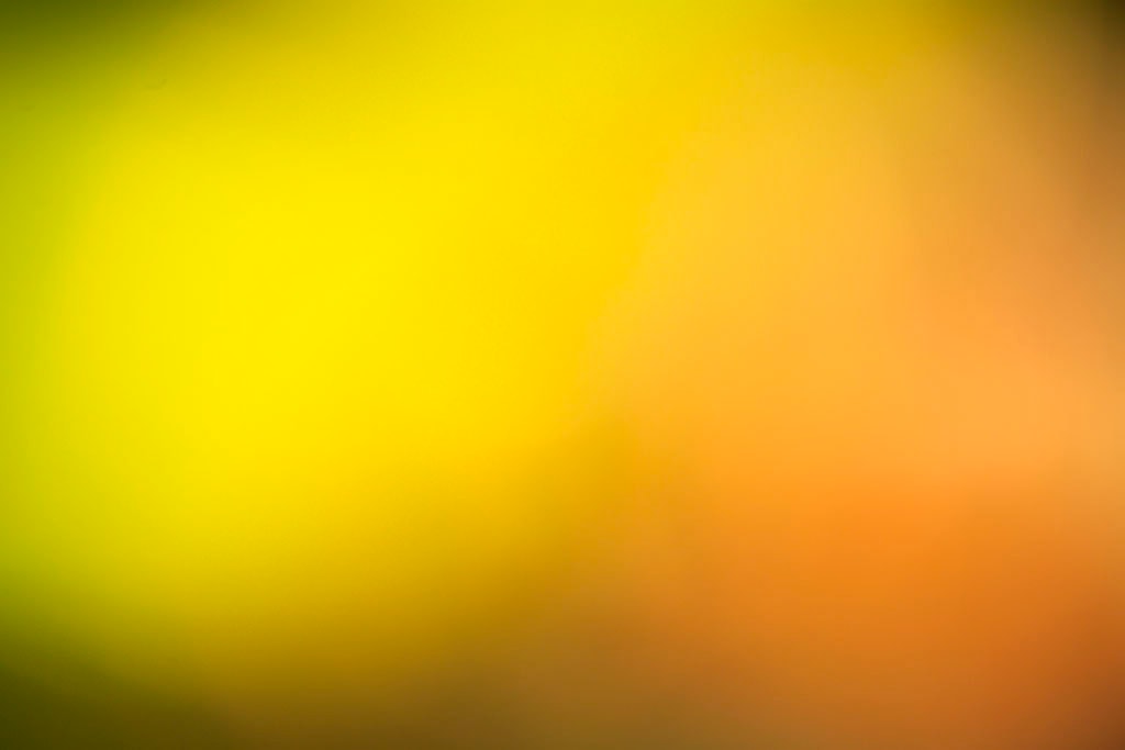 Maui, Hawaii 2018 — vivid yellow-orange abstract, bright chartreuse-yellow left half fading to warm peach-orange right half