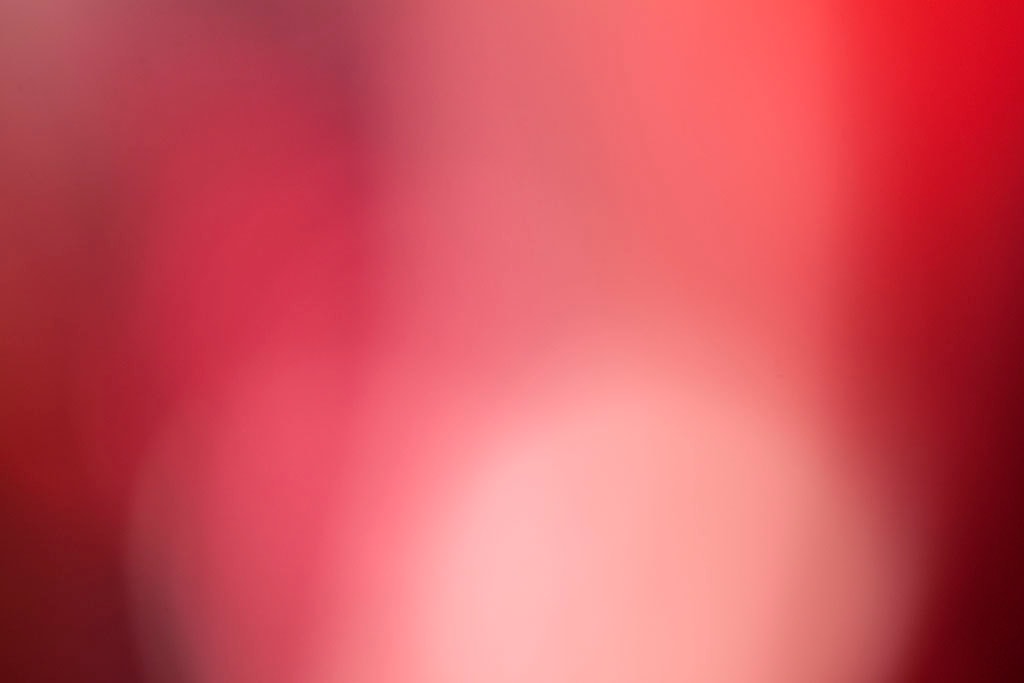 Maui, Hawaii 2018 — soft crimson and blush abstract, pale pink glow rising from deep burgundy lower left through rose center to bright red upper right