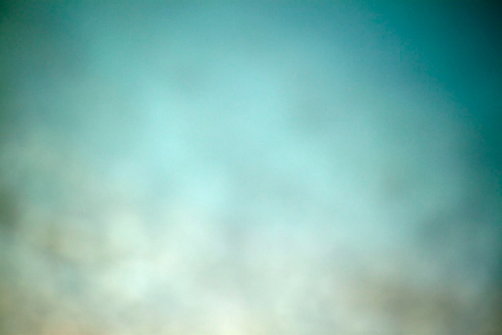 Yellowstone, WY 2016 — muted teal sky with warm white cloud glow below